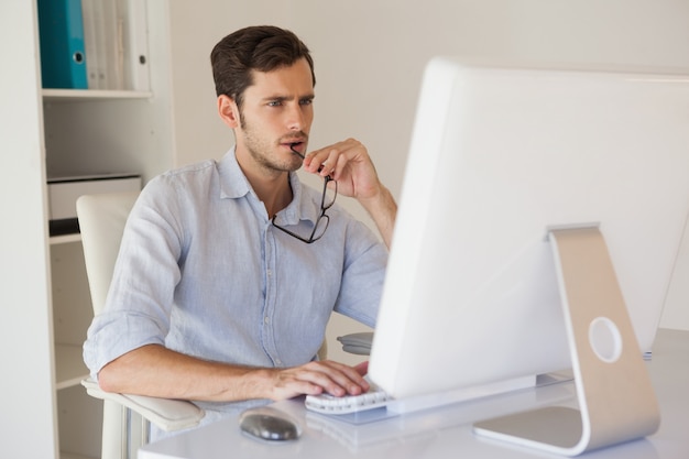 Casual businessman working at his desk