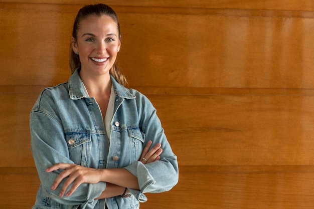 Casual businesswoman smiling with arms folded stock photo