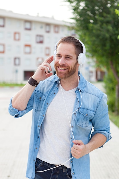 Casual guy with a denim clothes in the street 