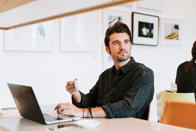 Casual man working in a cafe