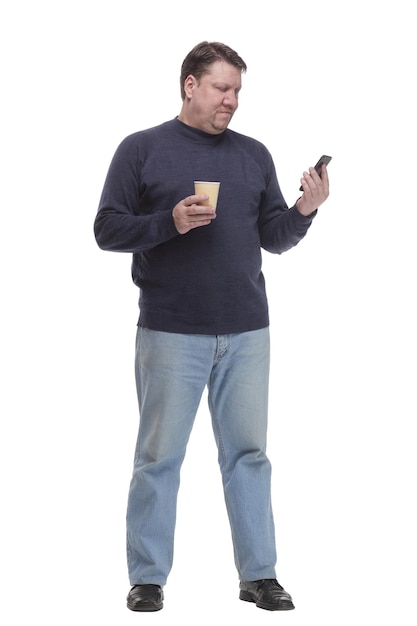 Casual mature man with smartphone and takeaway coffee