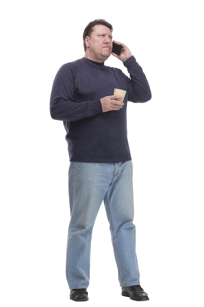 Casual mature man with smartphone and takeaway coffee