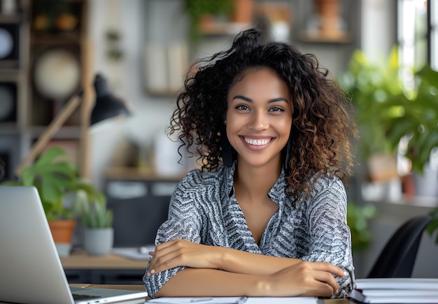 Casual Professionalism Young Black Woman Working on Laptop in Contemporary Workspace