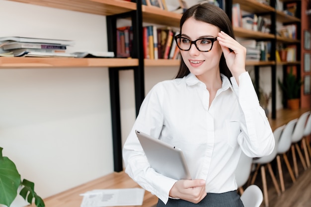 Casual woman in glasses in the office