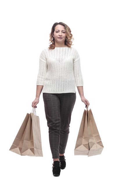 casual young woman with shopping bags. isolated on a white background.