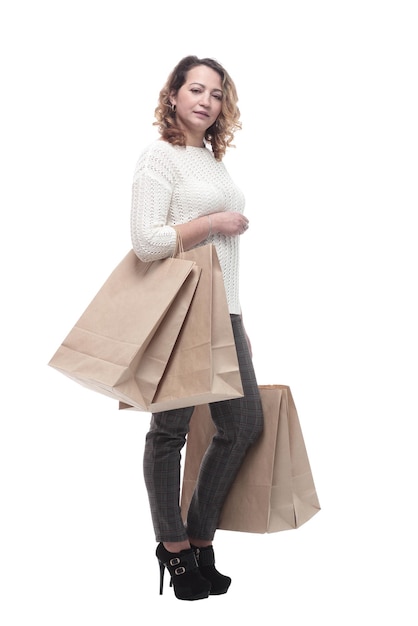 Casual young woman with shopping bags isolated on a white