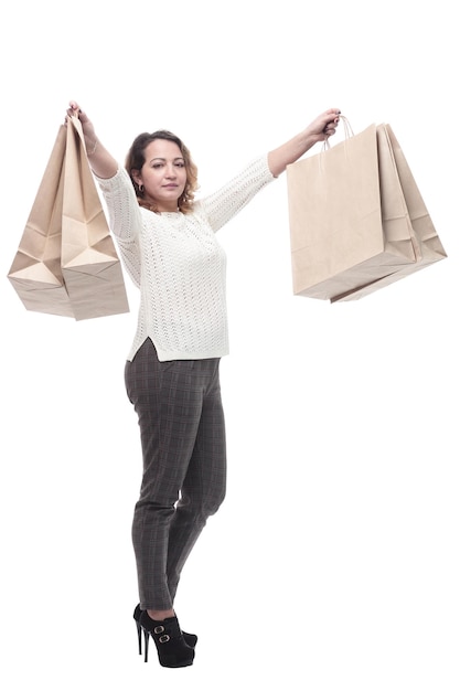 Casual young woman with shopping bags isolated on a white