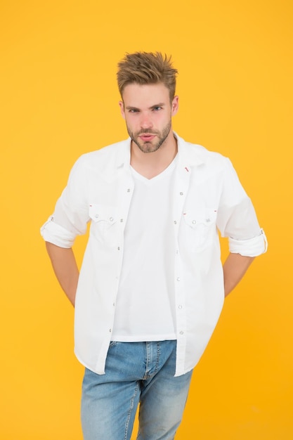 Casually handsome Casual urban lifestyle businessman in jeans and shirt portrait of millennial man in casual clothes Handsome man wear white tshirt and posing in studio