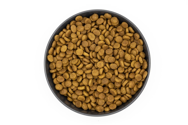 Cat food in a ceramic bowl isolated on white background Healty dry pet food