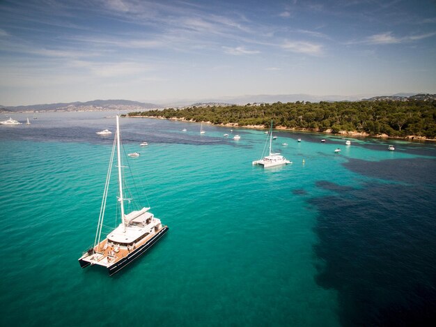 Catamaran sailing in blue water in South of France