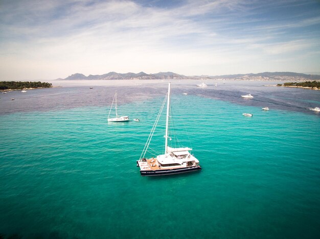 Catamaran sailing in blue water in South of France