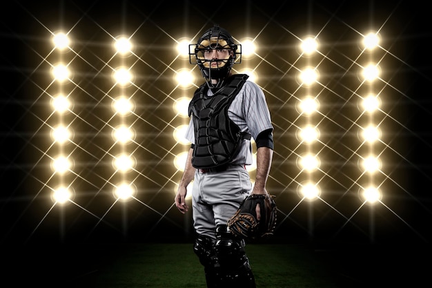 Catcher Player in front of lights.