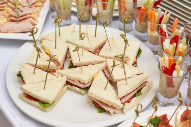 Catering food table of appetizers, snacks and canapes