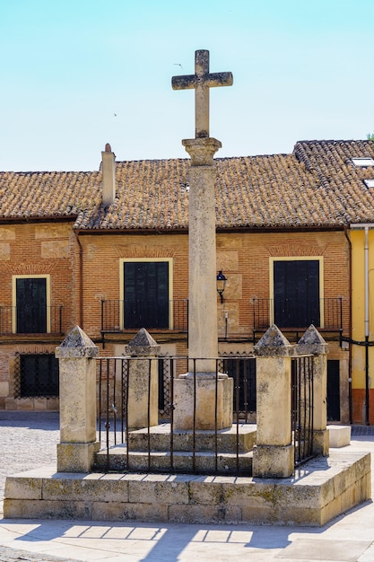 Catholic stone cross in the main town square of Torrelaguna Madrid