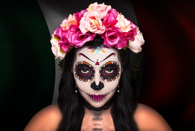 Catrina makeup lady with the flag of Mexico in the background