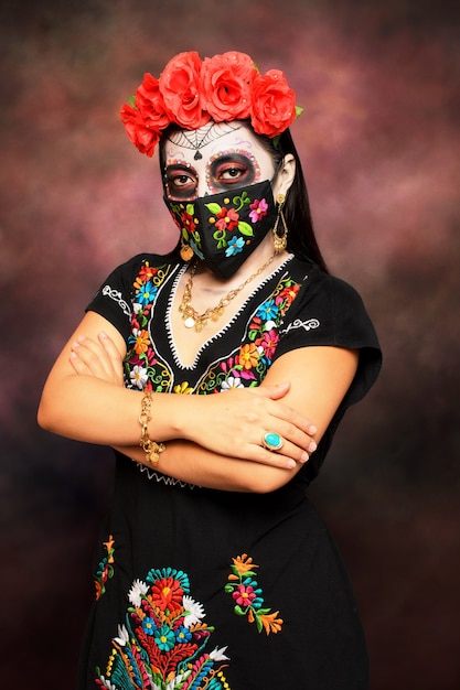 Catrina with embroidered face mask Girl made up as a catrina for  the Day of the Dead