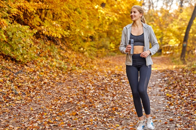 Caucasian beautiful woman running in the forest