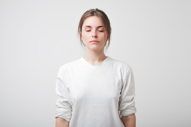 Caucasian beautiful woman with her eyes closed