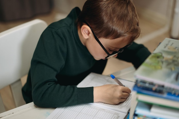 Caucasian boy doing homework at home