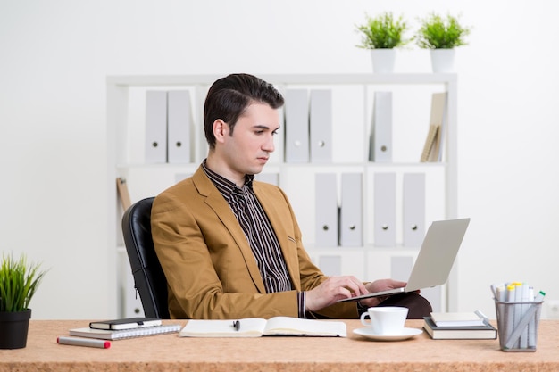 Caucasian businessman using laptop