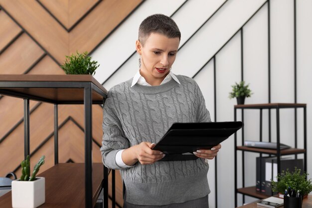 Caucasian businesswoman with a folder for documents in the office