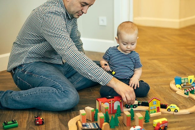 Caucasian father playing with little boy at home Authentic moment fatherhood lifestyle concept