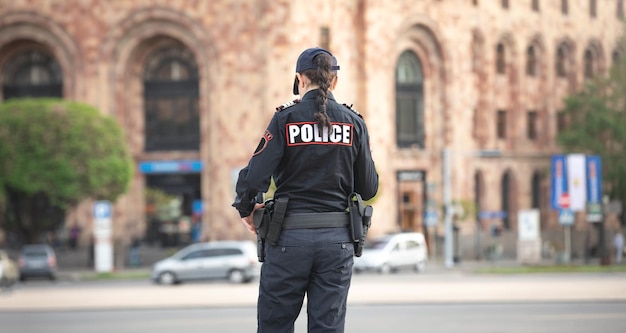 Caucasian female police officer in the city