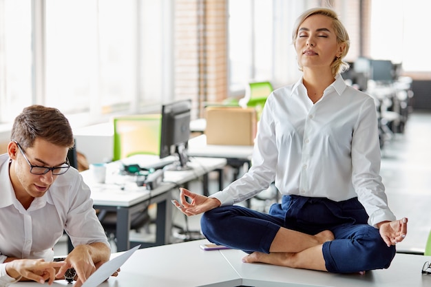 Caucasian female at work keep calm, keep balance of mental and psychological health