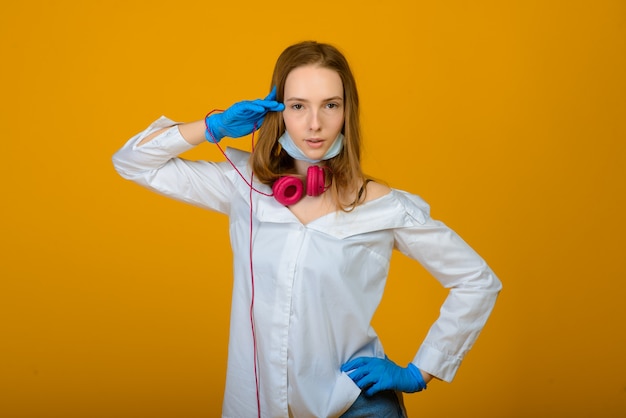 caucasian girl in blue protective face mask.