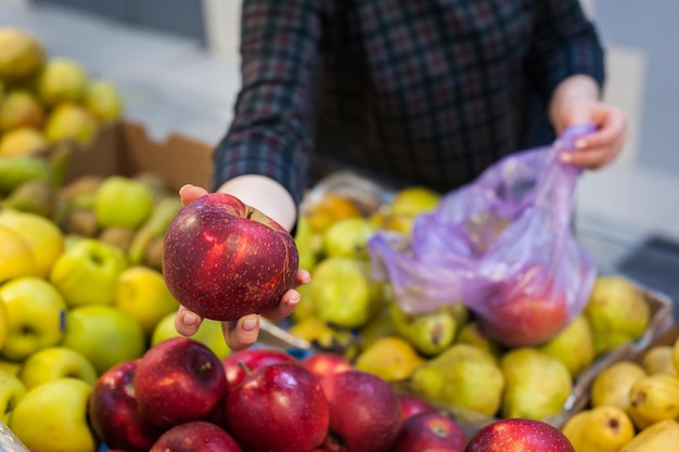 Caucasian girl buying fresh vegetables food products at the marketxA