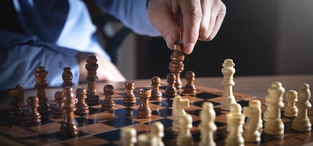 Caucasian man playing chess board game