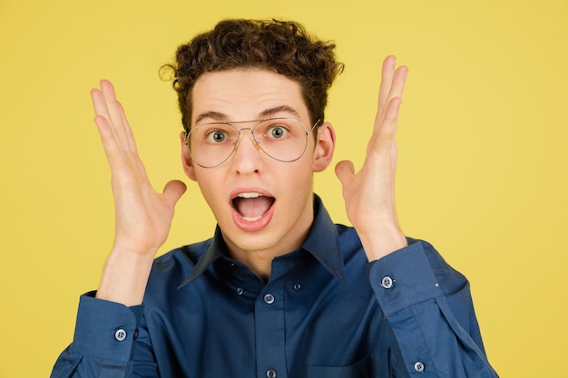 Caucasian man's portrait isolated on yellow studio background with copyspace