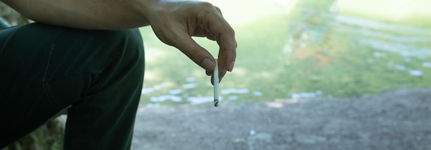 Caucasian man smoking a cigarette