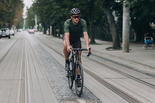 Caucasian man spending leisure time for cycling outdoors