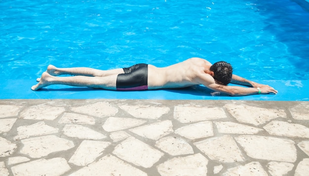 Caucasian man in the swimming pool.