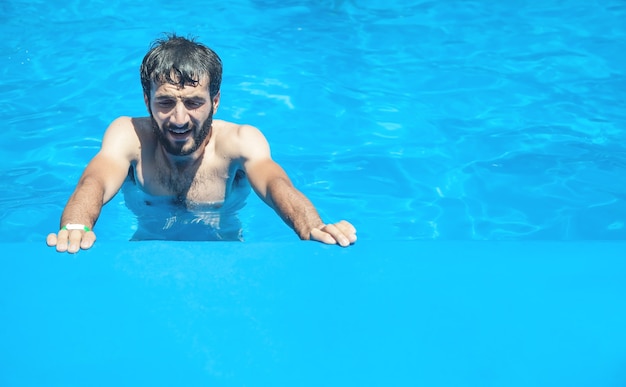 Caucasian man in the swimming pool.