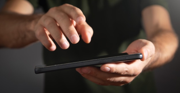 Caucasian man using smartphone at office