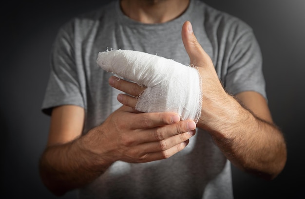 Caucasian man with bandage in injured hand