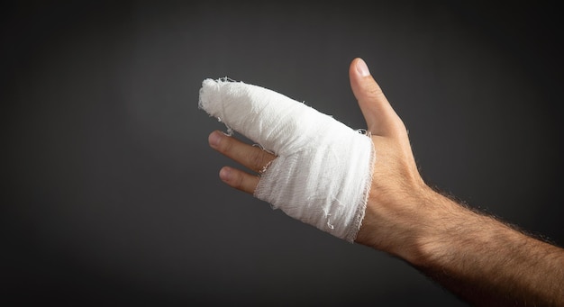 Caucasian man with bandage in injured hand