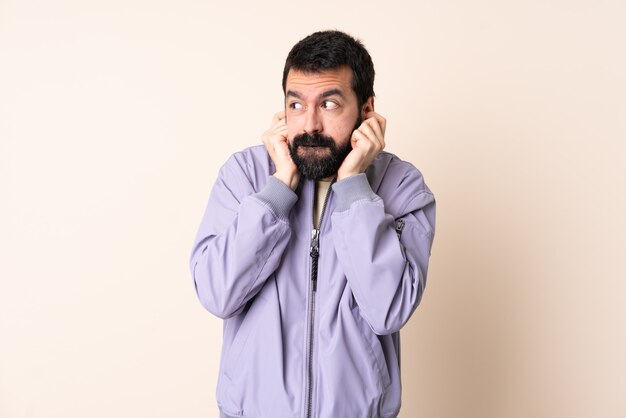 Caucasian man with beard wearing a jacket isolated