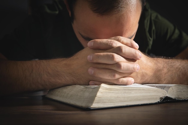 Caucasian man with a Holy Bible Religion Education