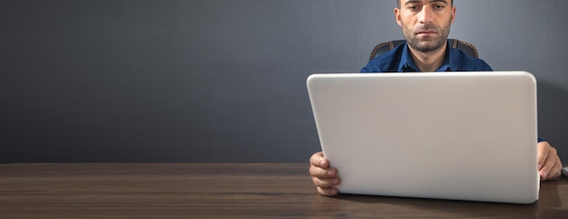 Caucasian man working with laptop computer