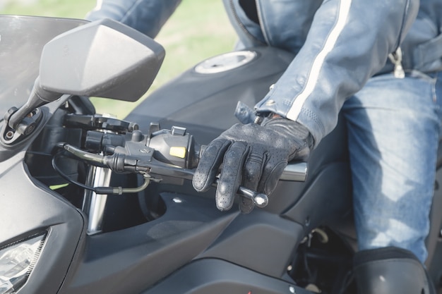 Caucasian motorcyclist with a black glove Transport Speed Sport