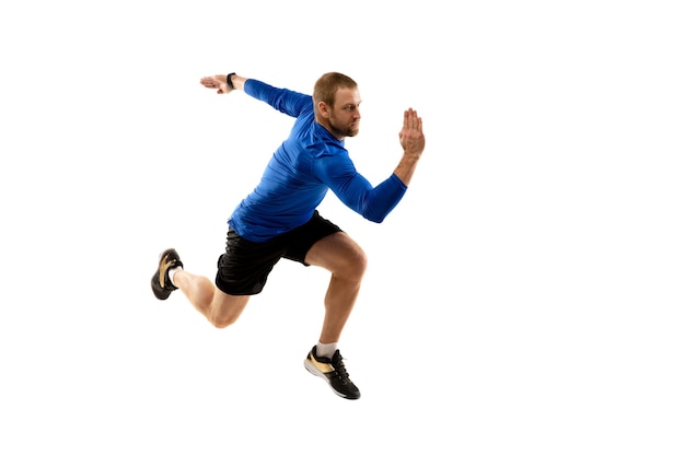 Caucasian professional runner, jogger training isolated on white studio background in fire