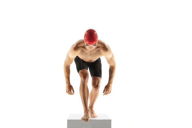 Caucasian professional sportsman, swimmer training isolated on white studio background