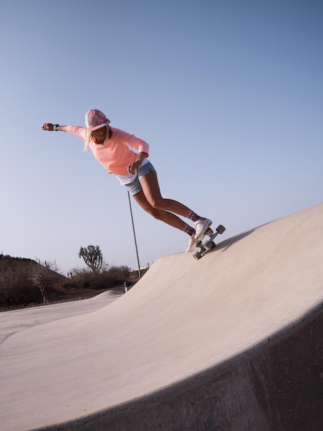 Caucasian skater woman on the skate ramp