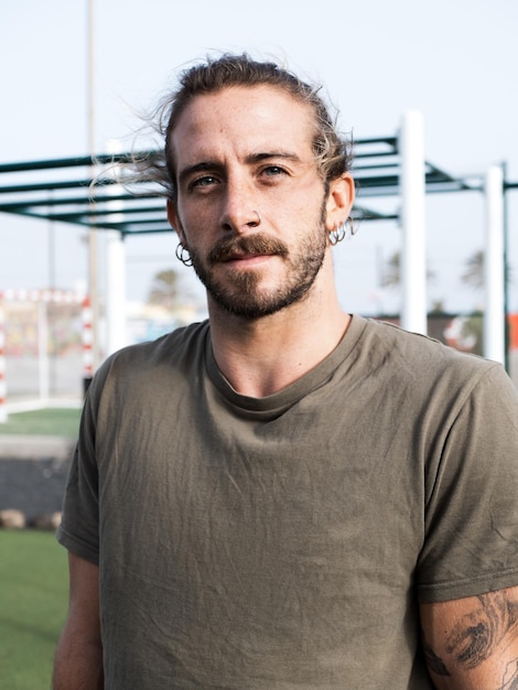 Caucasian sport man portrait outdoor in the calisthenics park