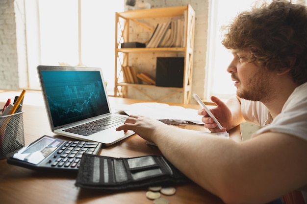 Caucasian upset and despair man doing financial and economical reports