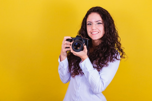 Caucasian woman Brazilian photographer holding photo camera taking pictures Advertising audio visual