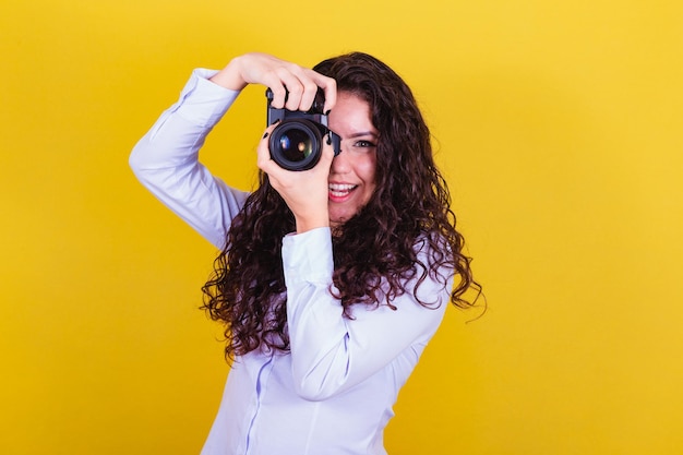 Caucasian woman Brazilian photographer holding photo camera taking pictures Advertising audio visual